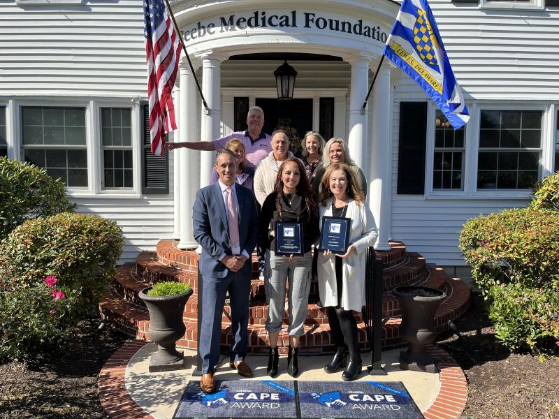 Gathered for the award presentation are in back (l-r) David Szumski and Karen Duffield, Beebe Medical Foundation; middle row Sue Tucker and Amanda Neal, BMF; and Loretta Ostroski, Beebe Healthcare vice president of inpatient nursing and emergency services. In front are Dave Matoska, Cintas Healthcare; Estefania Proano, award winner; and Iris Verdi, Beebe Healthcare EVS director. SUBMITTED PHOTO